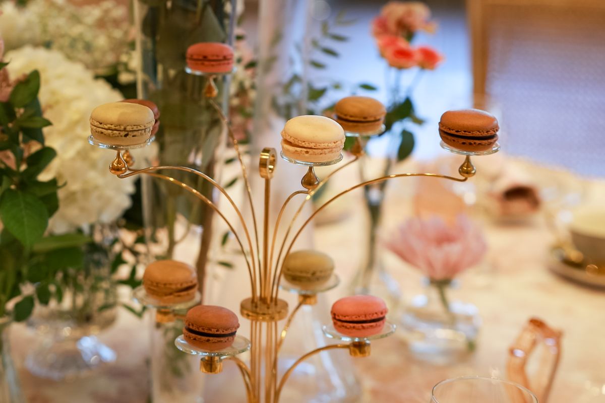 Golden macaron tree among flowers at the tea station