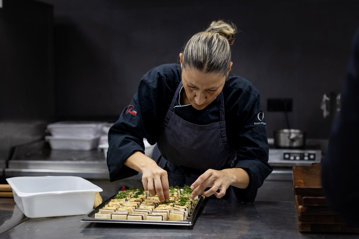 Cook plating bites in the Miravalle kitchen