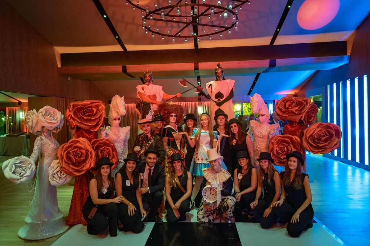 The cast of characters with part of the team in The Meadow
