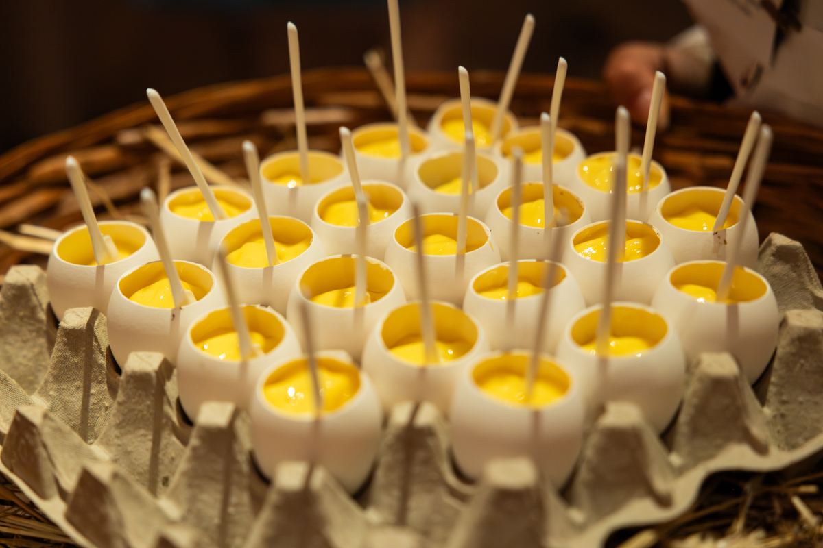 Bites served in eggshells in an egg box