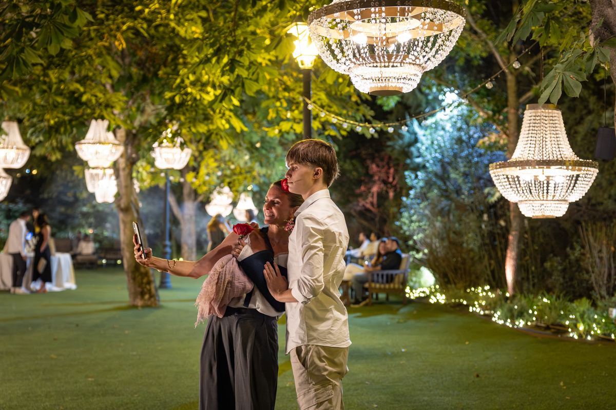 Guests beneath the crystal chandeliers in the garden