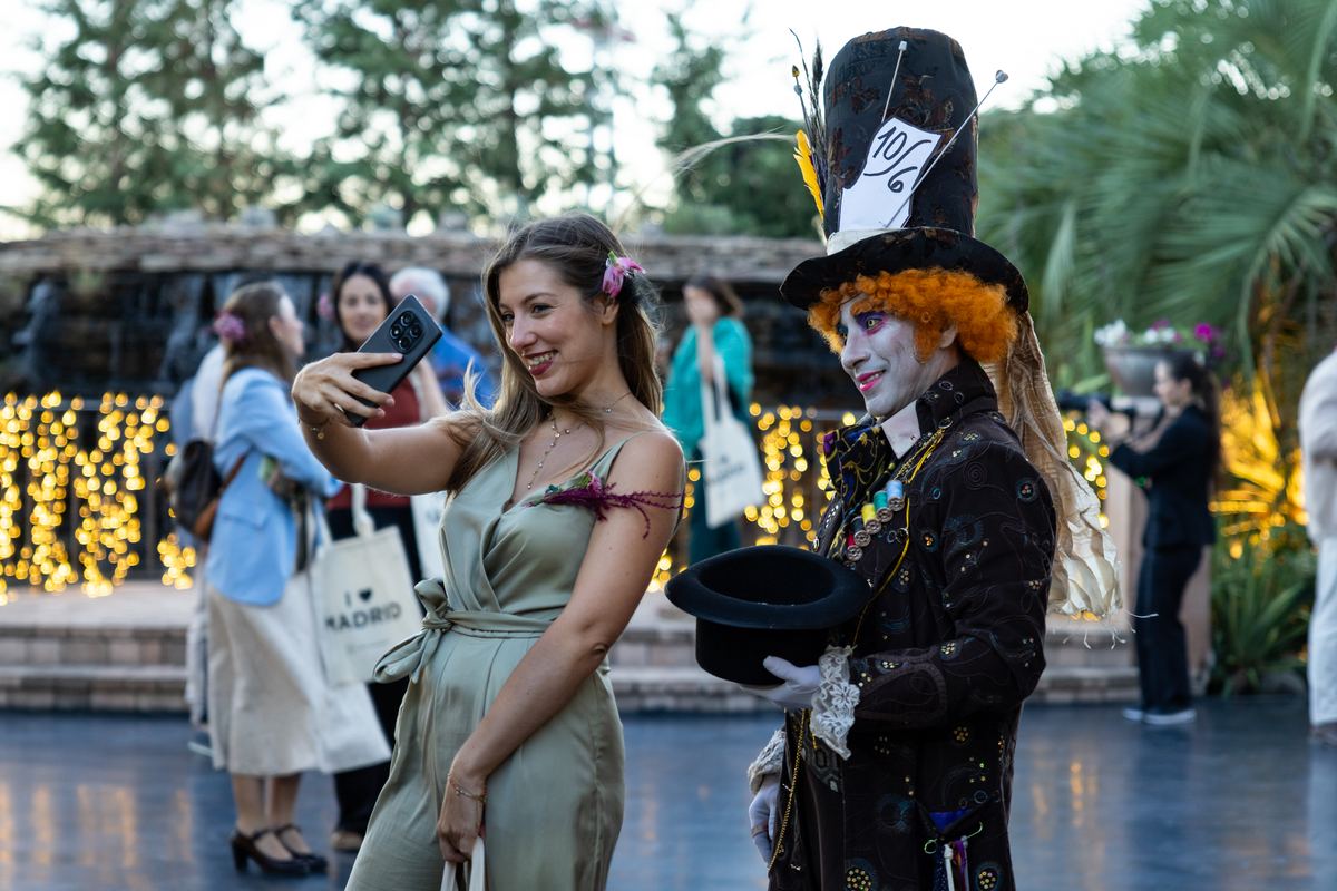 Guest taking a selfie with the Mad Hatter