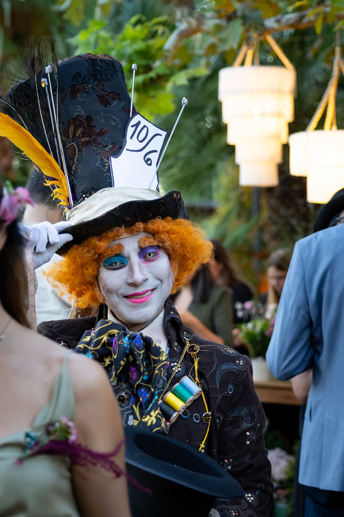 The Mad Hatter among guests in the gardens at Miravalle