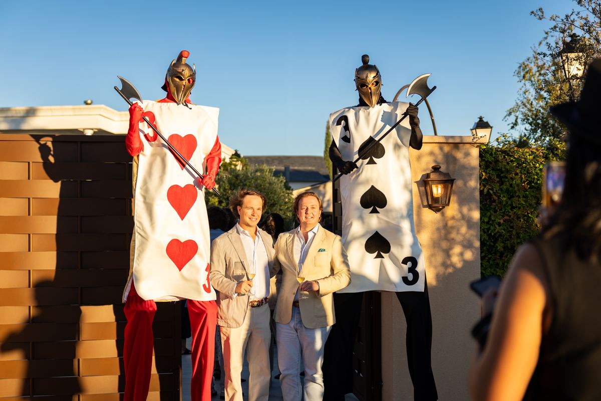 Two actors dressed as card soldiers welcome guests at the entrance to Miravalle