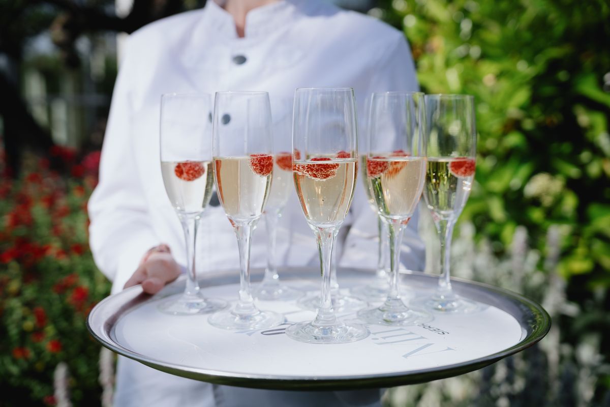 Tray of cava glasses in the garden at Finca Miravalle