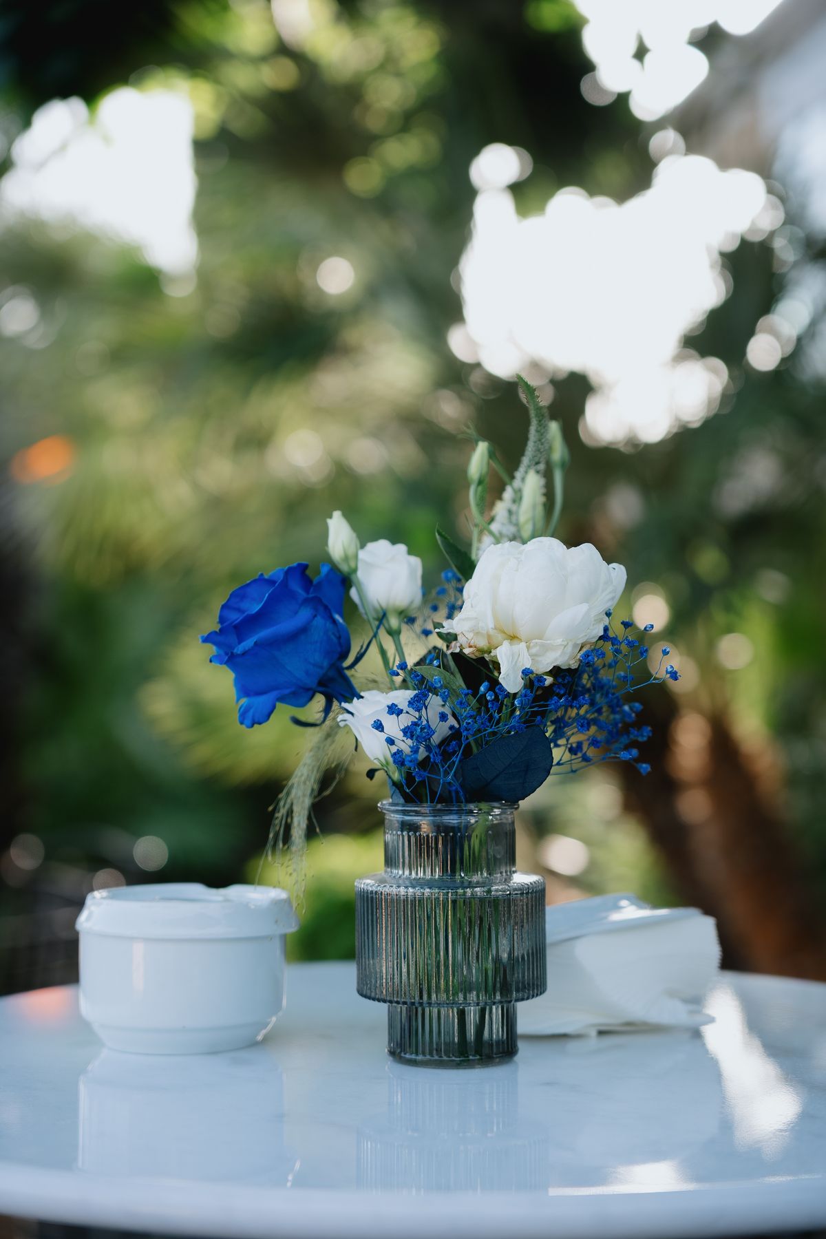 Blue floral centrepiece on a wedding table