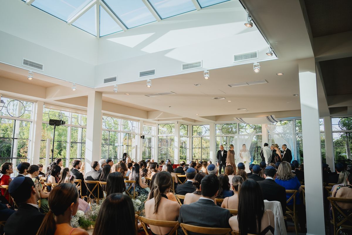 Guests during a ceremony in La Galería at Finca Miravalle