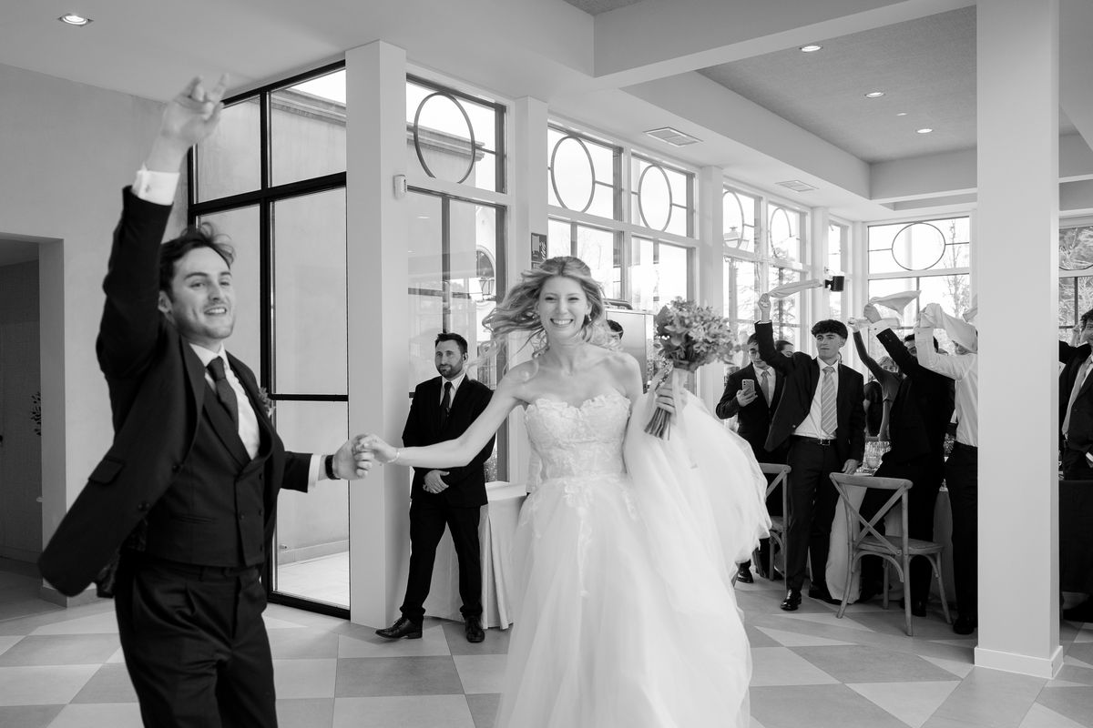 The newlyweds enter the banquet to applause